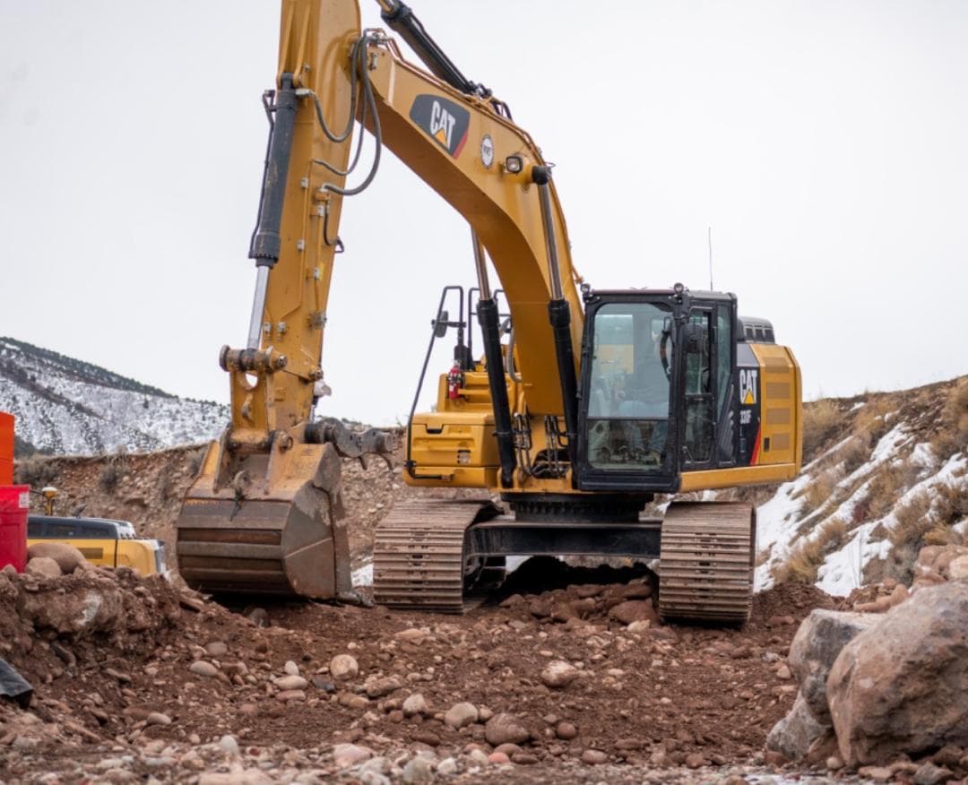 Caterpillar 336F excavator on rocky ground
